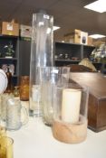 A group of glass vases, to include a large cylindrical clear glass vase, h60, a Stuarts glass