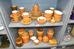 A Hornsea Saffron pattern dinner service decorated having geometrical patterns on an orange/tan
