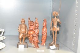A hand carved wooden figure of a Spanish solider, h25cm, sold together with a wooden Buddha ect, ( 5