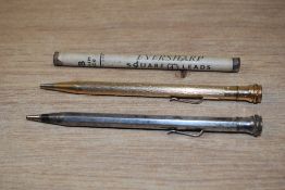 Two Wahl Eversharp propelling pencils and a box of Eversharp leads