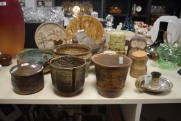 A group of earthenware pottery to include a Larbert lidded jar, a Riccardo Marzi bowl, an owl ect, (