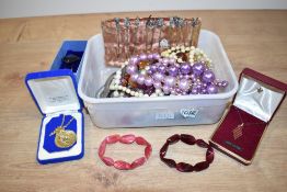 An assortment of costume jewellery, including beaded necklaces, statement pieces and a gold plated