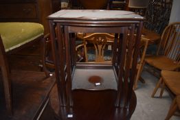 An early 20th Century mahogany nest of three tables