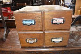 A set of four vintage index card drawers
