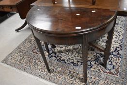 A 19th Century mahogany demi lune fold over tea table, width approx. 90cm