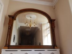 A large over mantel wall mirror having turned supports and gilt detailing , width approx. 187cm