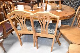 A Ducal pine oval extending dining table and set of six similar chairs
