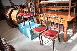A set of four late 19th or early 20th Century mahogany salon chairs