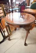 An early 20th Century mahogany occasional table having circular top with gadrooned edge, diameter