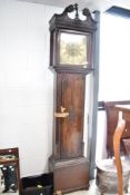 An 18th Century Irish long case clock having eight day movement and brass dial, named for Alex