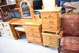 A selection of modern pine bedroom furniture comprising dressing table, mirror, stool and two