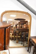 A gilt frame over mantel wall mirror, width approx. 130cm