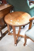 An early 20th Century oak occasional table having circular top, diameter approx. 47cm