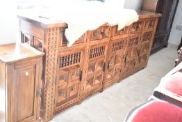 A Spanish colonial style sideboard of large proportions, dimensions approx. W252 H99 D44cm