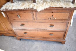 An early 20th Century oak chest of two over two drawers, width approx. 107cm