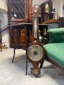 A 19th Century barometer of onion form , silvered dials named for D Luvate , Preston