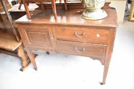 An Edwardian mahogany bedroom cabinet