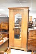 A late Victorian oak single mirror door wardrobe, width approx. 95cm