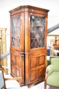 A pair of nice quality reproduction oak corner displays in the period style