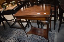 An early 20th Century mahogany fold over card table