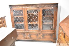 An Old Charm style triple bookcase, dimensions approx W162 D35 H139cm