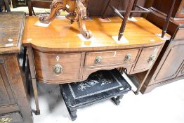 A 19t Century Regency design small sideboard or desk having lion mask handles, width approx. 111cm