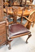 A reproduction hardwood carver chair in the Georgian style