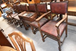 A set of six (four plus two) early to mid 20th Century oak dining chairs with upholstered leather