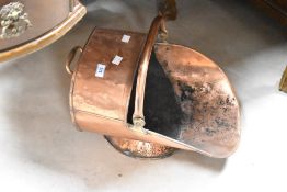 An antique copper coal helmet