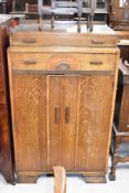 An early 20th Century oak tallboy