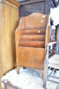 An early 20th Century mahogany paper rack, width approx. 42cm