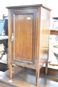 An Edwardian mahogany pot cupboard