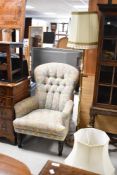 A reproduction Victorian style button back easy chair having floral upholstery, with Sherbourne
