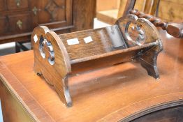 An early 20th Century oak book trough, width approx. 31cm
