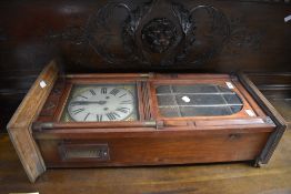 A late Victorian stained frame wall clock