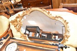 A vintage gilt frame scroll mirror