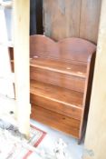 A stained pine low bookshelf, width approx. 68cm