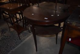 A reproduction demi lune hall table