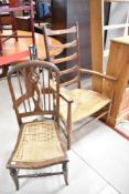 A cane seated bedroom chair and rush seated ladderback chair