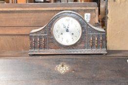 An early 20th Century oak cased mantel clock