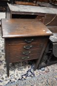 A late 19th four drawer office chest on square legs, approx. height 77cm