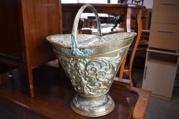 A Victorian brass coal helmet having double hinged lid (af) with lozenge and other impressed marks