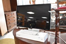 An Apple thunderbolt display and accesories
