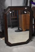 An oak frame canted wall mirror, approx. 87 x 61cm