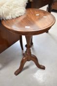 A reproduction Indian pedestal occasional table, diameter approx. 50cm