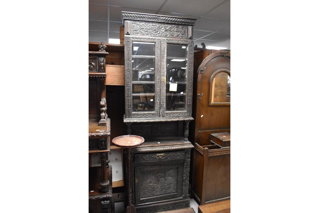 A period oak carved display cabinet , of Dutch design, height approx. 214cm