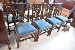 A set of four mahogany framed Chippendale style dining chairs