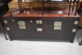 An Oriental double cupboard, directions approx. W138 D47 H60cm