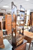 An oak narrow bookshelf having double drawer base, width approx. 36cm