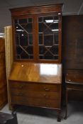 An early 20th Century mahogany bureau bookcase